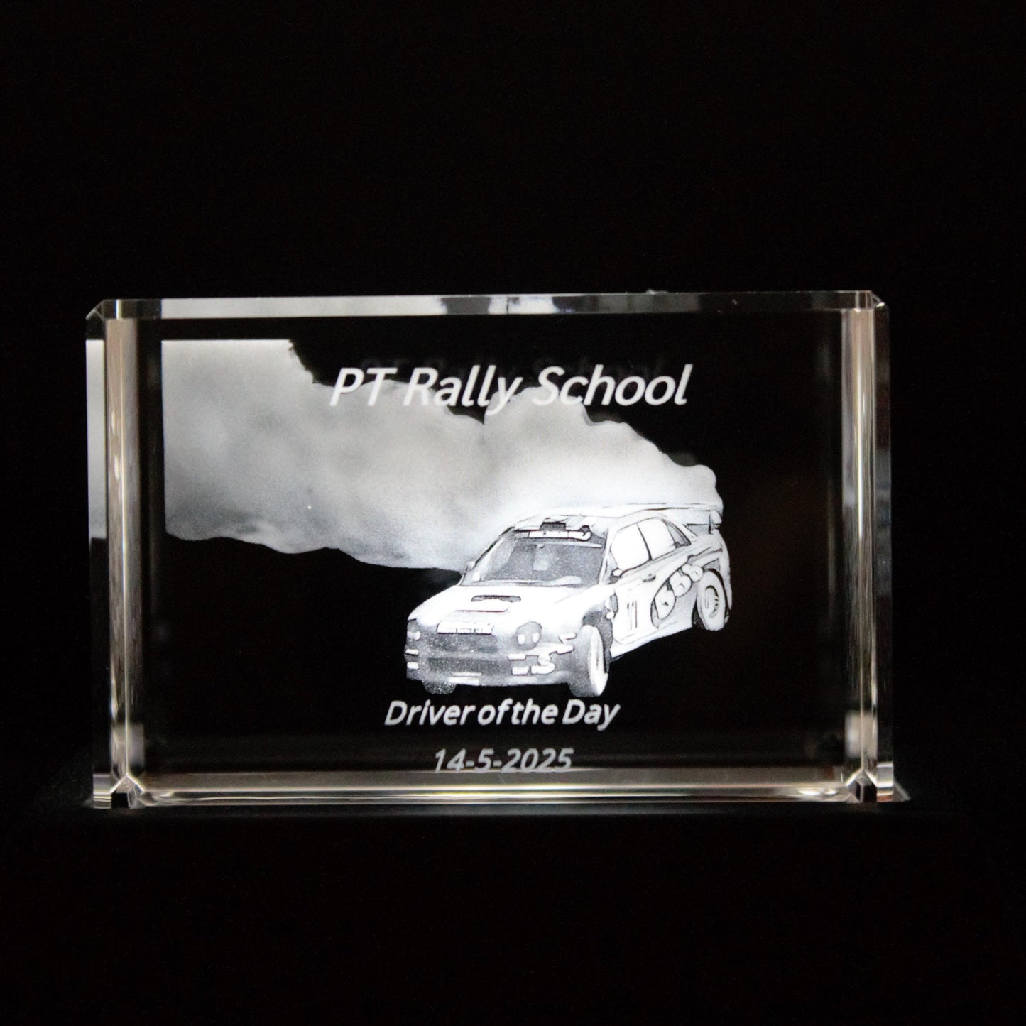 Crystal award with a car design and text on a black background