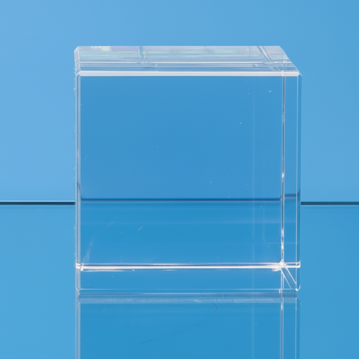 Clear glass block on a blue background
