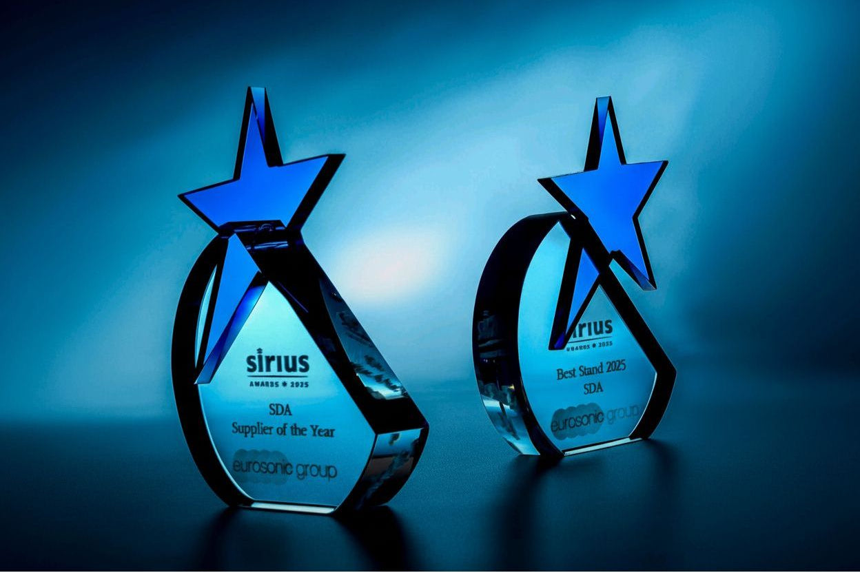 3d Crystal  showing Two star-shaped glass awards with 'Sirius' branding on a blue background