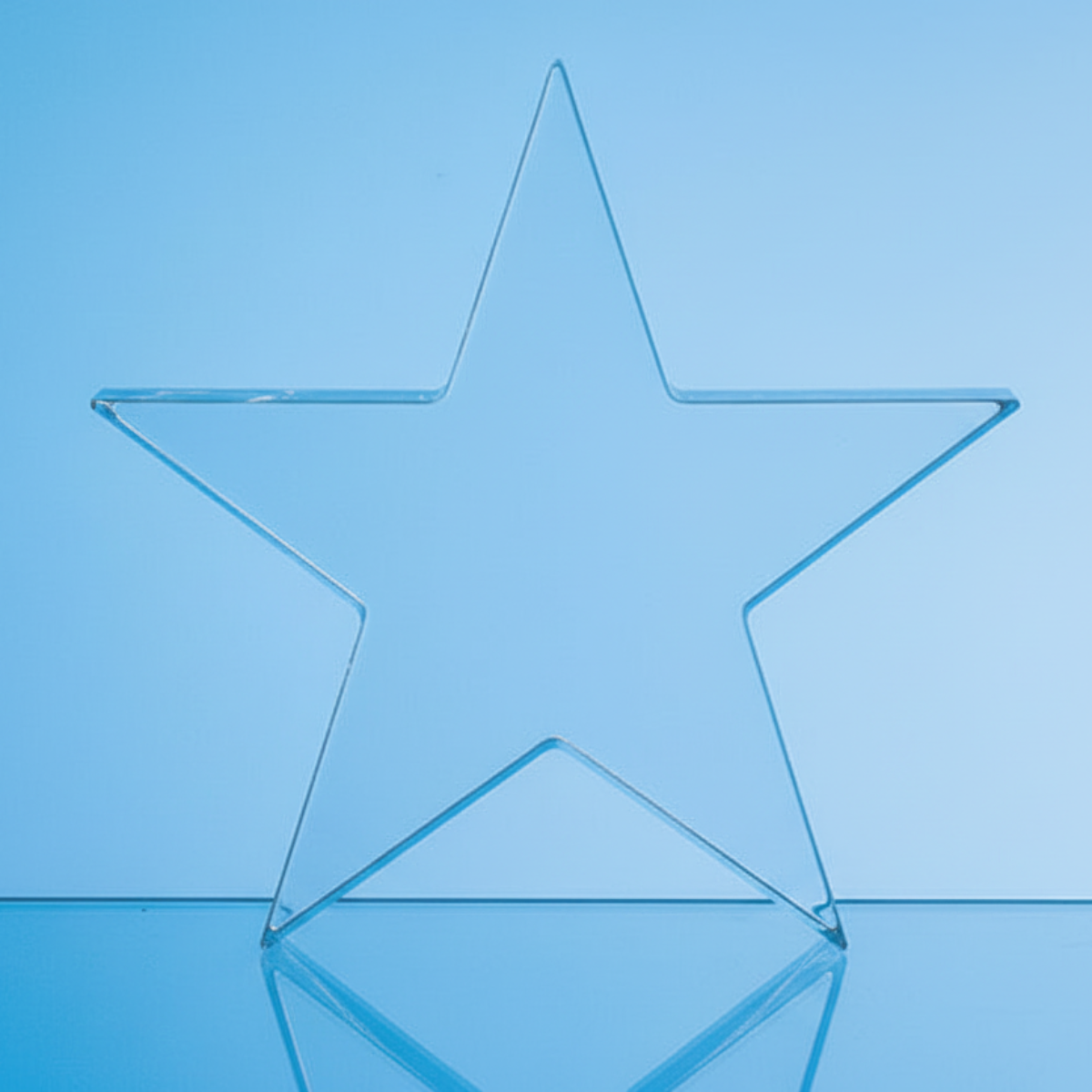 Clear glass star on a blue background