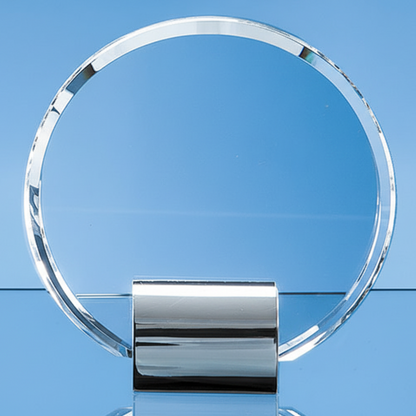 Clear glass circular award on a blue background