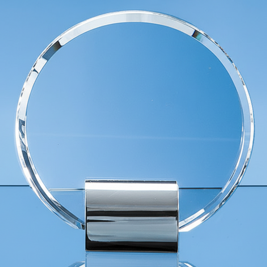 Clear glass circular award on a blue background