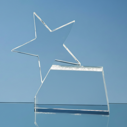 Clear star-shaped award on a blue background