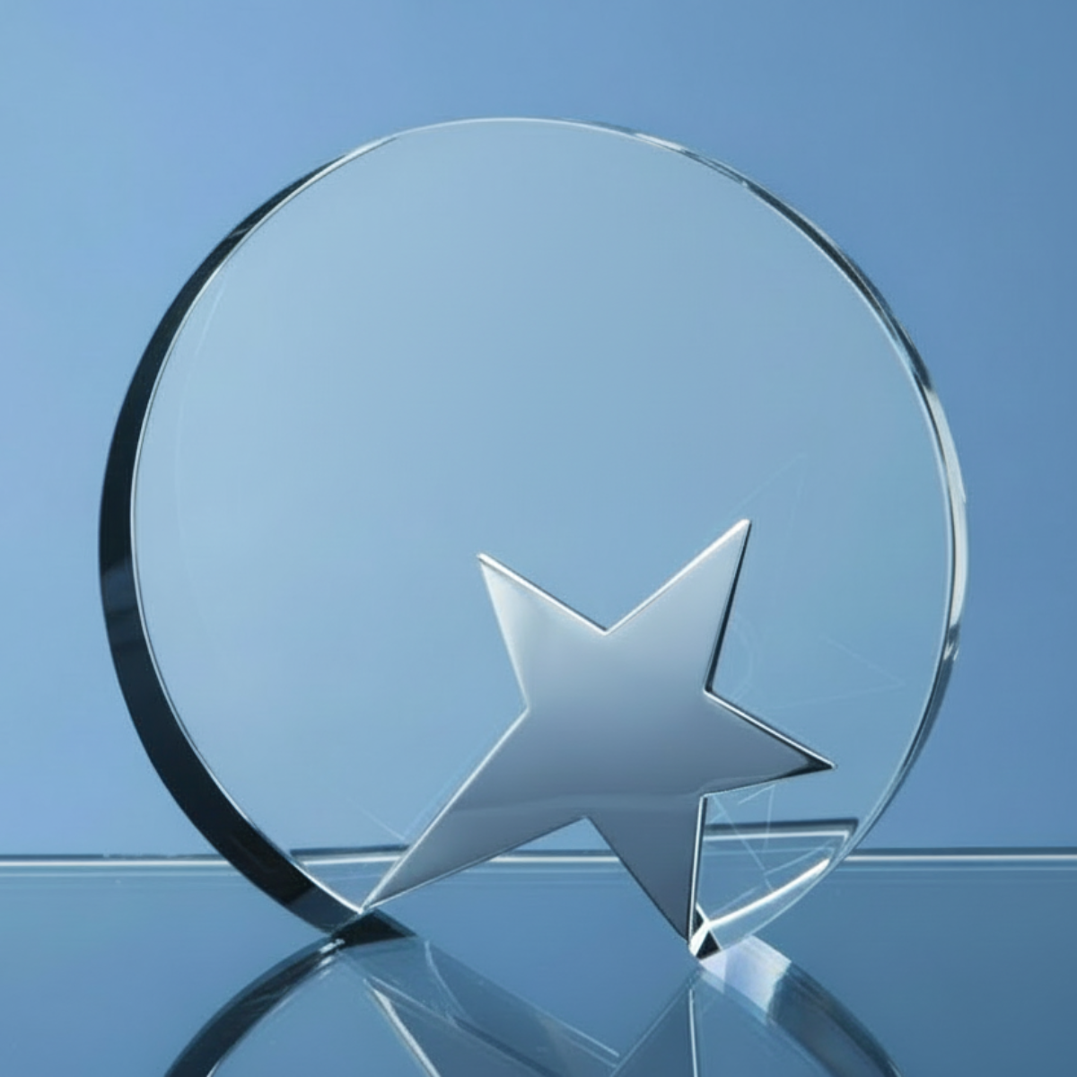 Clear glass award with a star on a blue background