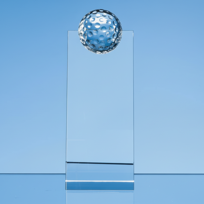 golf trophy in glass wedge with gol ball at top 
