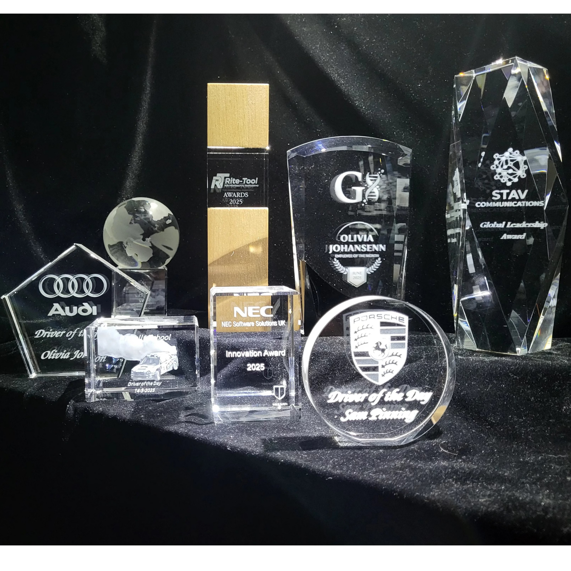 8 crystal glass awards on a display stand 